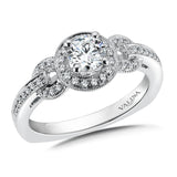 Diamond halo engagement ring mounting with milgrain detailing and side stones set in 14k white gold.