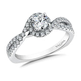 Diamond engagement ring mounting with split shank and side stones set in 14k white gold.