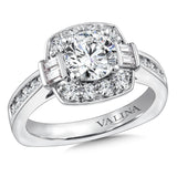 Diamond halo engagement ring mounting with baguette and round side stones set in 14k white gold.