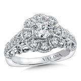 Floral diamond halo engagement ring mounting with side stones set in 14k white gold.