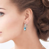 7x5 MM Oval Shape Aquamarine and 1/6 ctw Round Cut Diamond Earrings in 14K White Gold