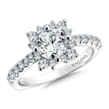 Varied sizes of prong-set diamonds surround the dazzling center stone. Pinched diamond shoulders add maximum sparkle.