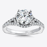 Diamond engagement ring mounting with side stones set in 14k white gold.