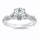 Oval center engagement ring with a diamond accented split shoulder in 14k white gold.