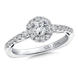 Diamond halo engagement ring mounting with side stones set in 14k white gold.