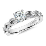 Diamond crisscross engagement ring mounting with side stones set in 14k white gold.