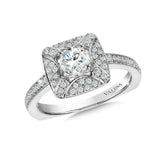 Diamond halo engagement ring mounting with side stones set in 14k white gold.