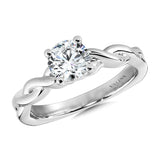 Polished twist engagement ring in 14k white gold, including two hidden accent diamonds under the center stone.