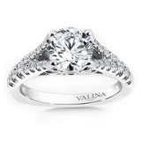 Diamond engagement ring with a diamond decorated split shank in 14k white gold.