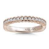 Diamond stackable wedding band with intricate milgrain detailing in 14k rose gold.