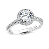 Diamond halo engagement ring mounting with side stones set in 14k white gold.