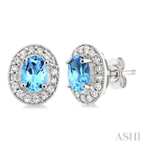 7x5 MM Oval Cut Blue Topaz and 3/8 Ctw Round Cut Diamond Earrings in 14K White Gold