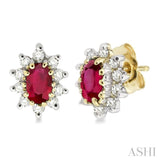 5x3MM Oval Cut Ruby and 1/4 Ctw Round Cut Diamond Earrings in 14K Yellow Gold
