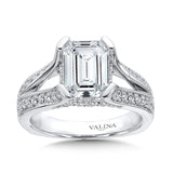 emerald-cut center is embellished with a diamond split shank and diamonds decorating the gallery for a bold look.