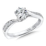 A diamond bypass design lights up the center stone. The polished profile adds a sleek touch to this classic ring.