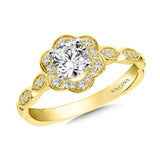 Floral diamond halo engagement ring mounting with side stones set in 14k yellow gold.