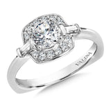 Diamond halo engagement ring mounting with baguette side stones set in 14k white gold.