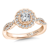 Floral diamond halo engagement ring mounting with side stones set in 14k rose gold.