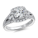 Diamond halo engagement ring mounting with side stones set in 14k white gold.