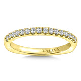 Diamond stackable wedding band in 14k yellow gold.