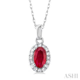 1/20 ctw Round Cut Diamond and 5X3MM Oval Shape Ruby Halo Precious Pendant with Chain in 10K White Gold