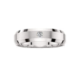 This elegant 14kt white gold mens wedding ring features a brushed satin finish and a single diamond accent totaling .05tw. Available in both yellow and white gold. Shown in 6.5mm.