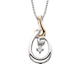 This two tone diamond pendant is part of the Diamond Dancer collection, a line of moving diamond jewelry. The .02ct center stone is set away from the skin so it constantly shimmy and shakes, dancing with the wearer's slightest movement. The pendant i...