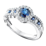 From the Aspire Collection, a vibrantly gorgeous blue sapphire is the centerpiece in this beautiful halo ring. Surrounded by alternating sapphire and diamonds, this ring is sure to make your loved one feel like a princess!